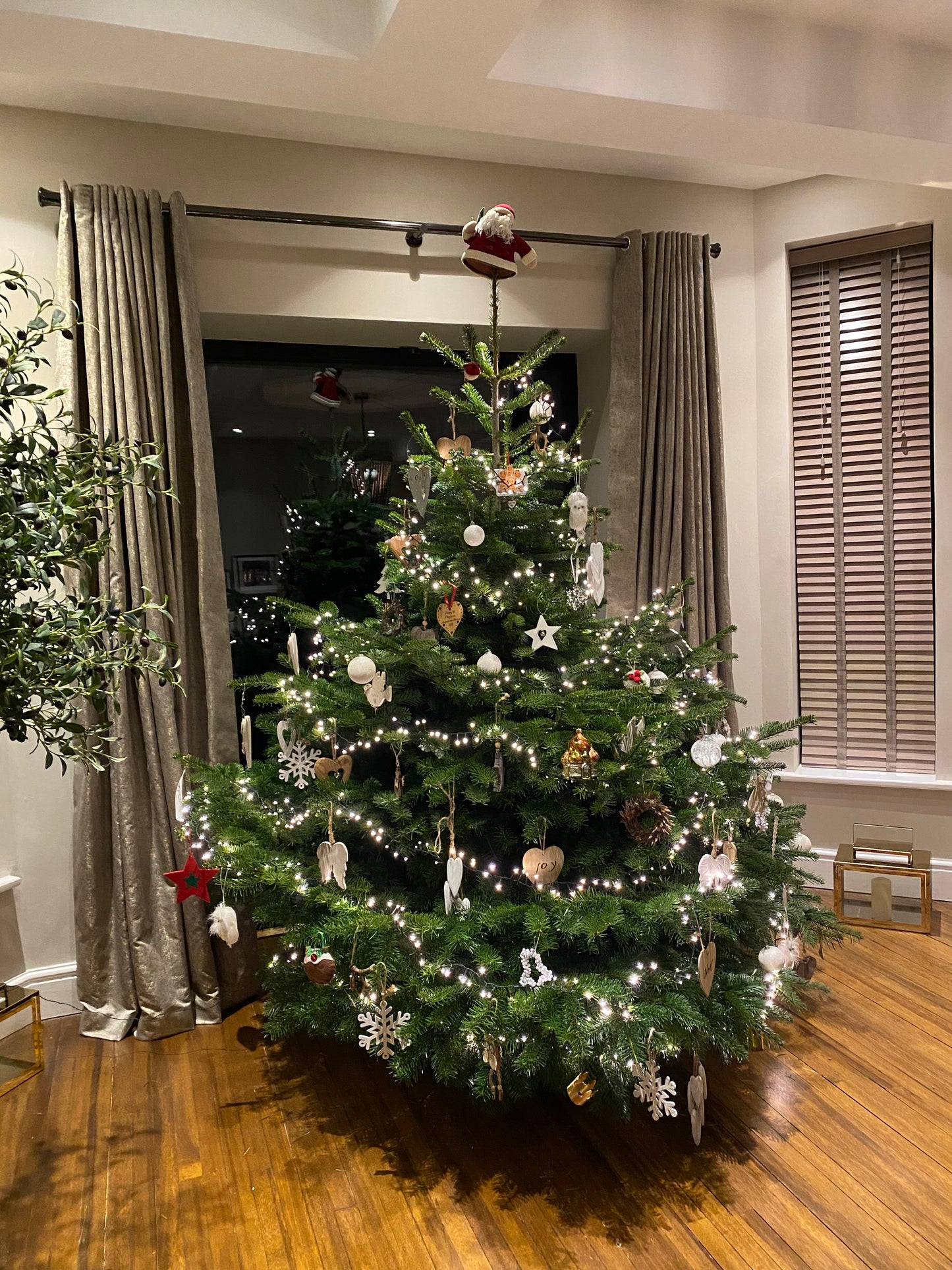 A lovely 7-8 foot Nordmann for decorated by a customer